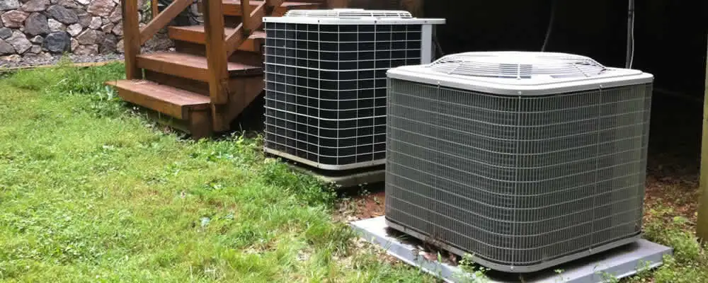 Heat pump installation and service units outside a home in Reading, MA