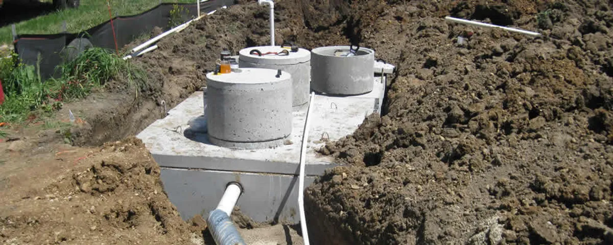 Septic system repair and installation site with tank access ports in Reading, MA