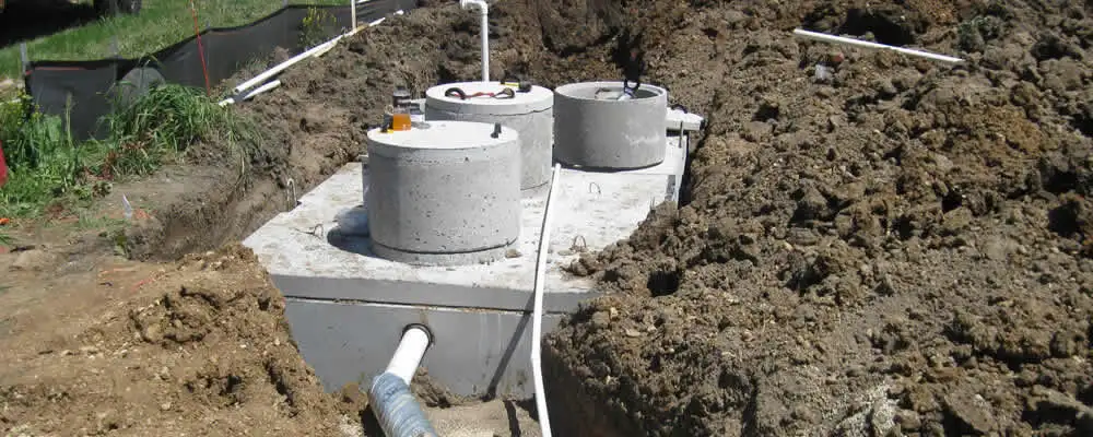 Septic system repair and installation site with tank access ports in Reading, MA